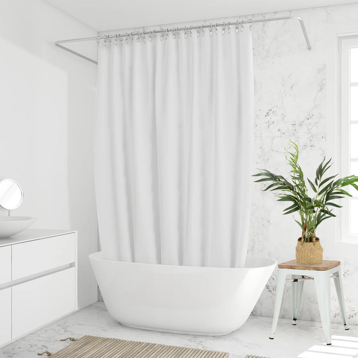 Planta artificial verde CHAMAEDOREA en una cesta tejida sobre un taburete blanco de hjh OFFICE
