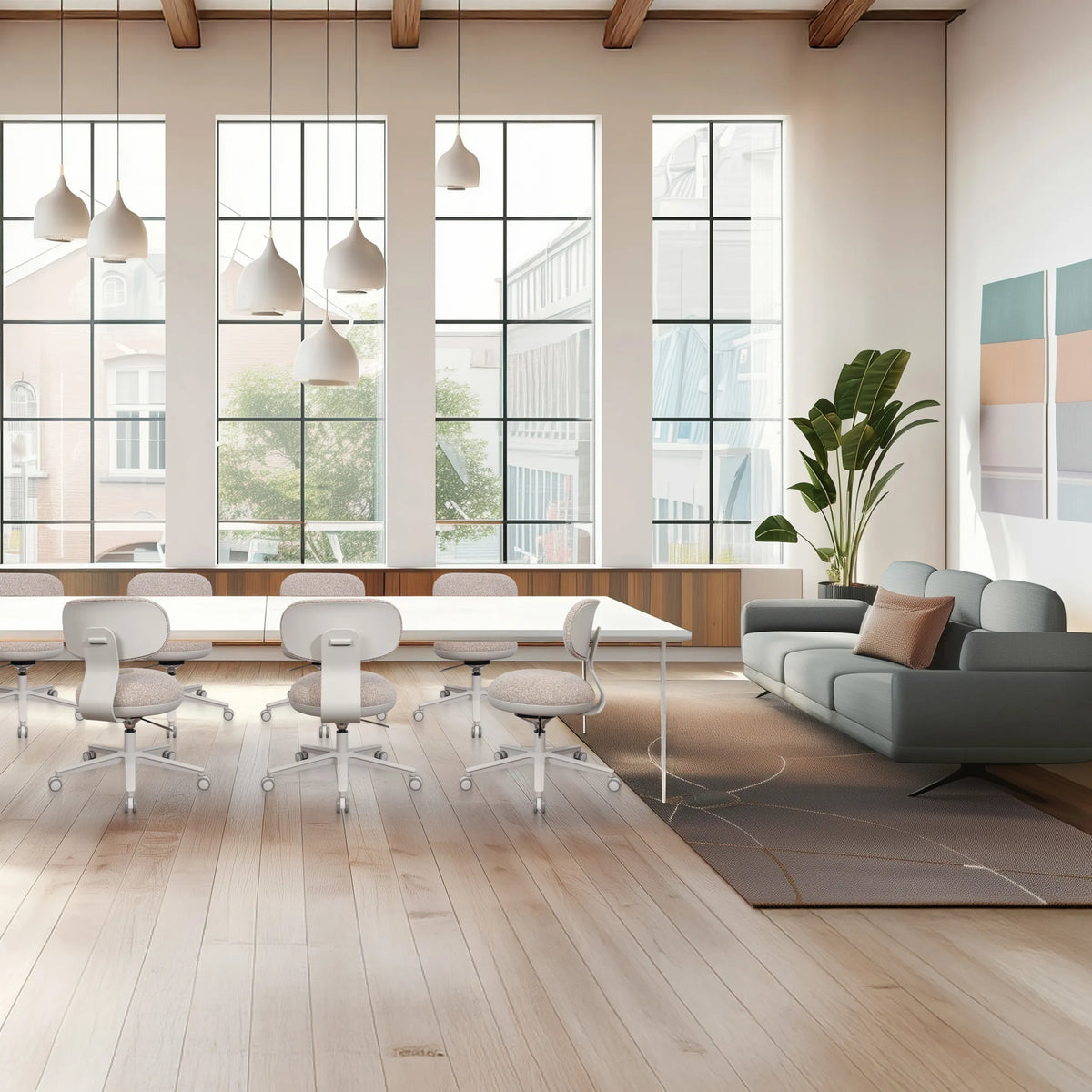 Silla Home Office SITMOTION W en gris con ruedas y reposabrazos en una habitación luminosa de hjh OFFICE