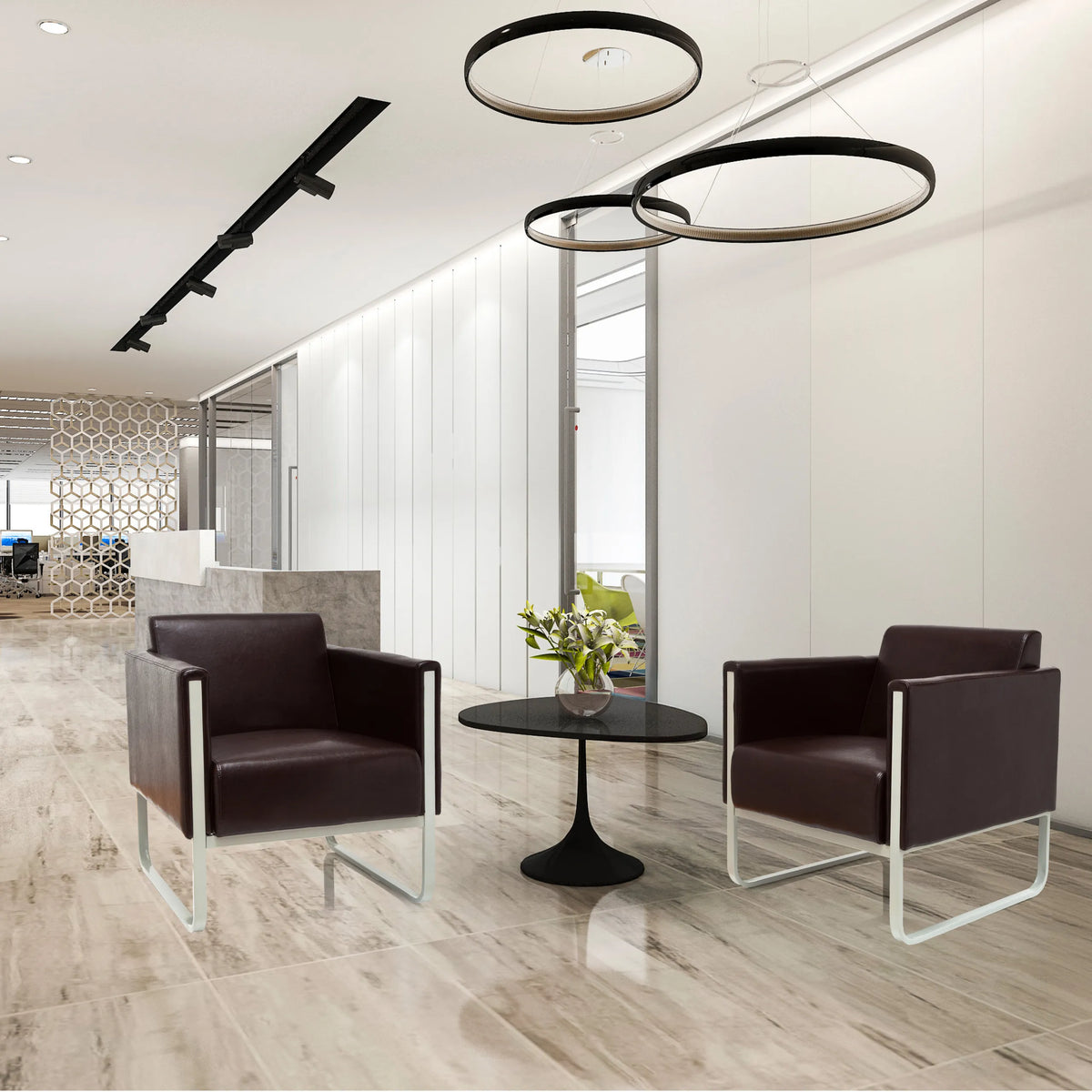 Dos sillones tapizados ARUBA marrones con estructuras metálicas plateadas y una mesa auxiliar redonda de hjh OFFICE