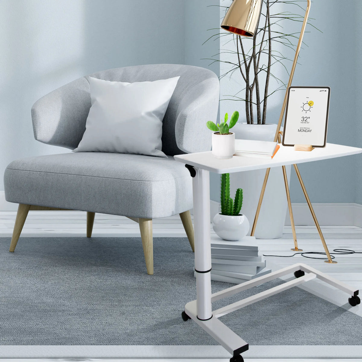 Escritorio de pie blanco STAND II con ruedas junto a un sillón gris de hjh OFFICE