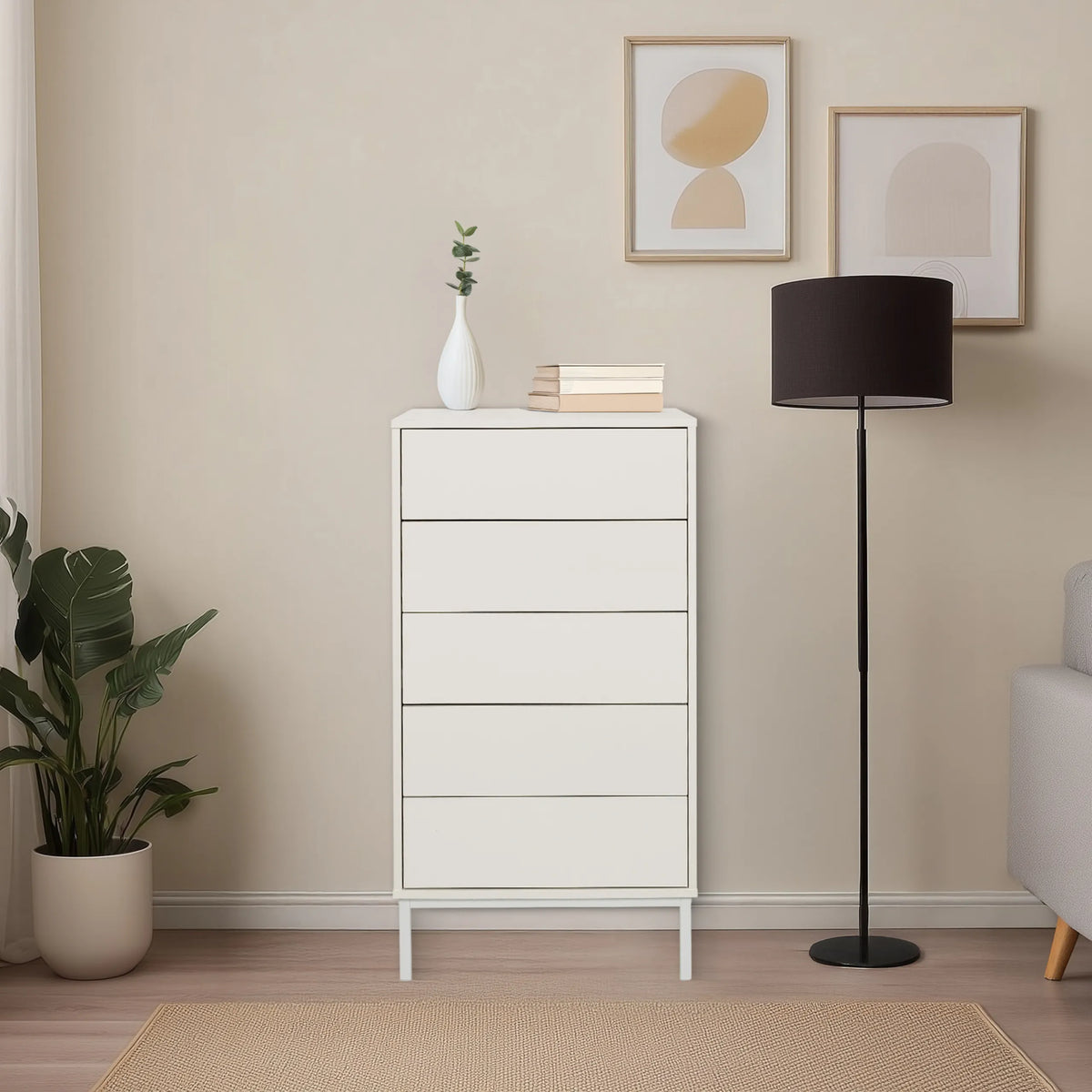 Cómoda blanca BJORDAL con cinco cajones y patas estrechas en una habitación luminosa de hjh LIVING