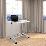 Escritorio de pie blanco STAND II con ruedas y portátil sobre un suelo de madera clara de hjh OFFICE