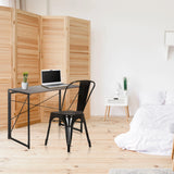 Silla de comedor VANTAGGIO COMFORT de metal negra en un escritorio de hjh OFFICE