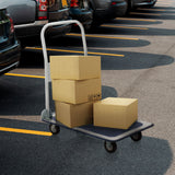 Carretilla de transporte CARRY azul y blanca con tres cajas de cartón cargadas en un aparcamiento de hjh OFFICE