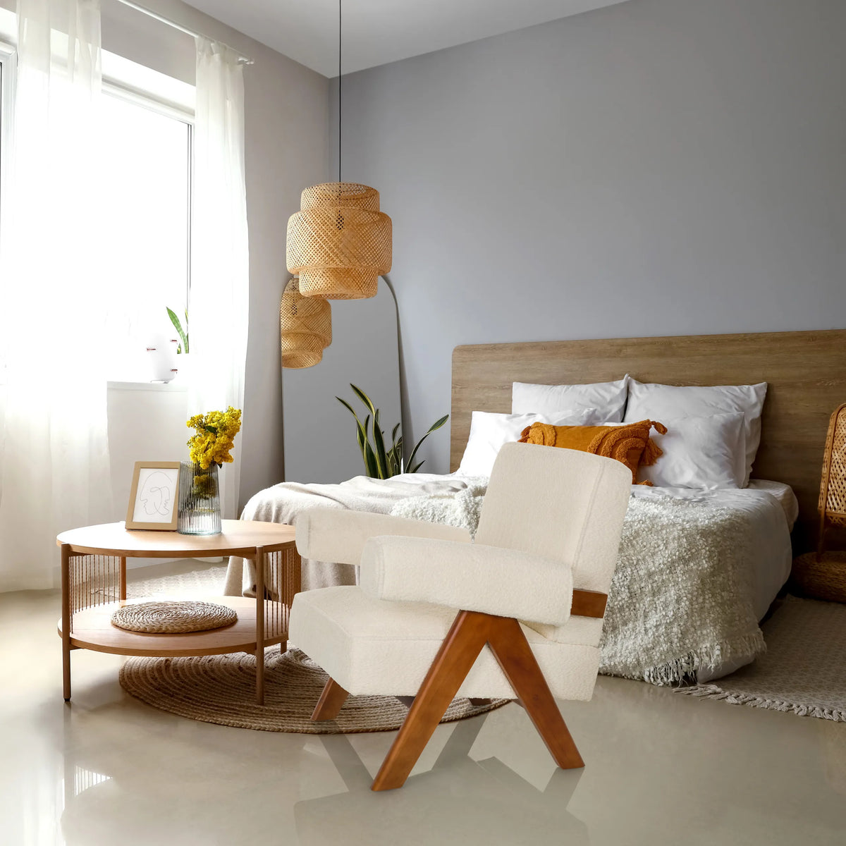Sillón de diseño POOLY blanco con patas de madera en un dormitorio luminoso de hjh LIVING