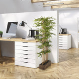 Planta artificial verde BAMBUS I en una maceta de madera oscura para la oficina de hjh OFFICE