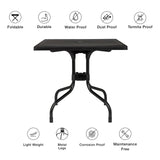 Mesa plegable TRAVANO T1 negra con patas de metal y símbolos de las propiedades del material y funciones de hjh LIVING