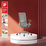 Silla alta gama VERVIO de color gris con respaldo de malla sobre un pedestal blanco con fondo rojo de hjh OFFICE