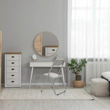 Silla plegable TUDELA BASIC gris de PVC en una habitación luminosa con un tocador blanco de hjh OFFICE