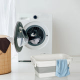Contenedor plegable CLEAN SILW gris y blanco junto a una lavadora de hjh OFFICE
