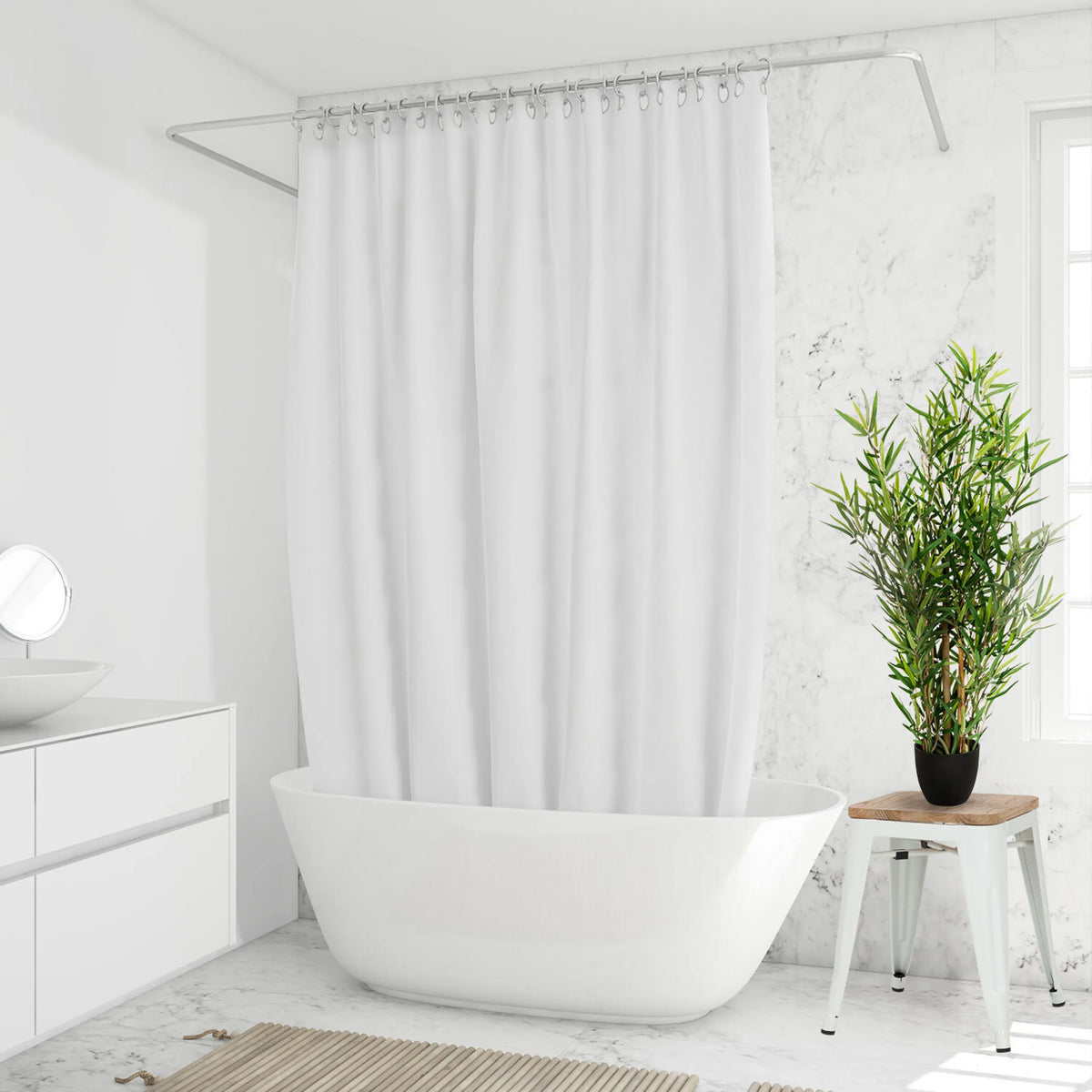 Planta artificial verde MINI BAMBUS en una maceta negra sobre un taburete blanco de hjh OFFICE